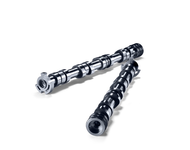 Two metallic camshafts with several cams are parallel. 